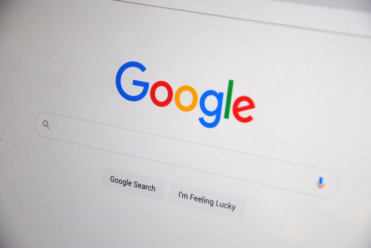 Offerings Close-up of the Google homepage on a screen showing search options.